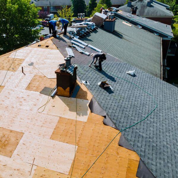 Midway through a full roof repair, Roofing Guys Perth replaces timber sheeting and installs new shingles to restore roof strength and durability.