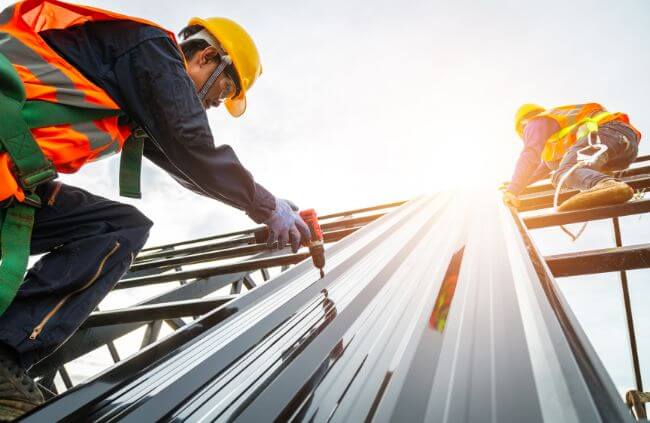 Roofing Guys Perth team working on a new metal roof installation for a commercial building, providing expert service across Perth. Roofing Guys Perth team working on a new metal roof installation for a commercial building, providing expert service across Perth.
