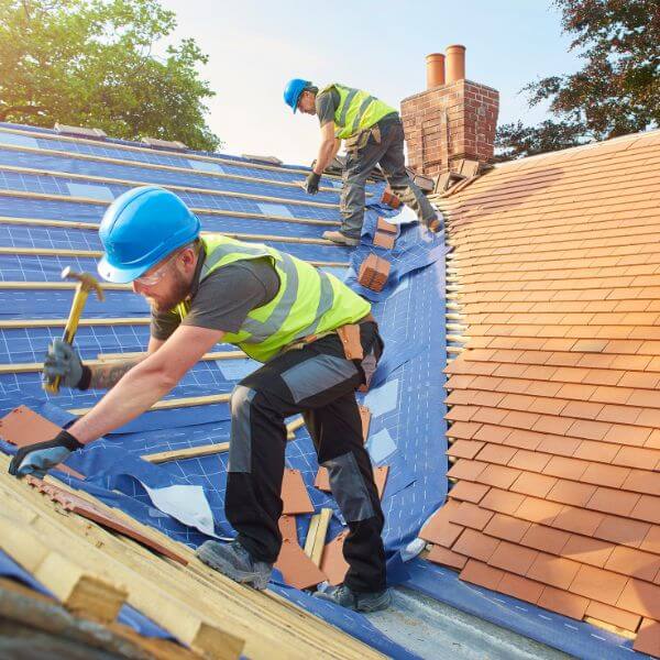 Roofing Guys Perth team working on a tiled roof installation for a residential extension, delivering high-quality finishes and reliable service.