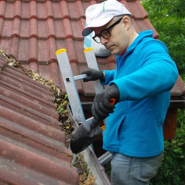 Professional gutter cleaning in Perth ensuring clear downpipes and proper water drainage by Roofing Guys Perth