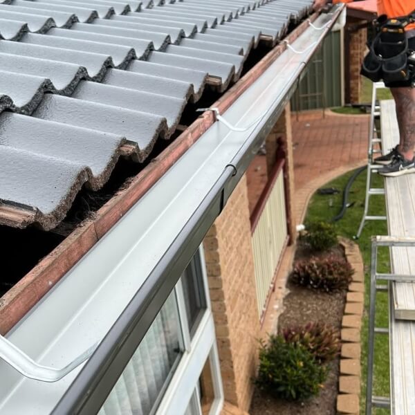 Professional gutter installation in Perth. Roofing Guys Perth installs new guttering on tiled roofs to handle heavy runoff and help prevent water damage.